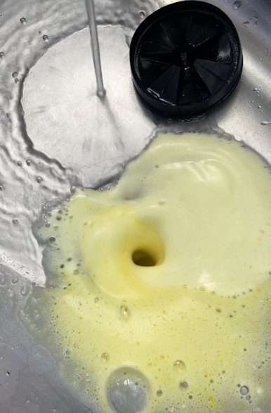ACTIVE Foaming Disposal Cleaner in action. Citrus foam fills the entire disposal, scrubbing every surface