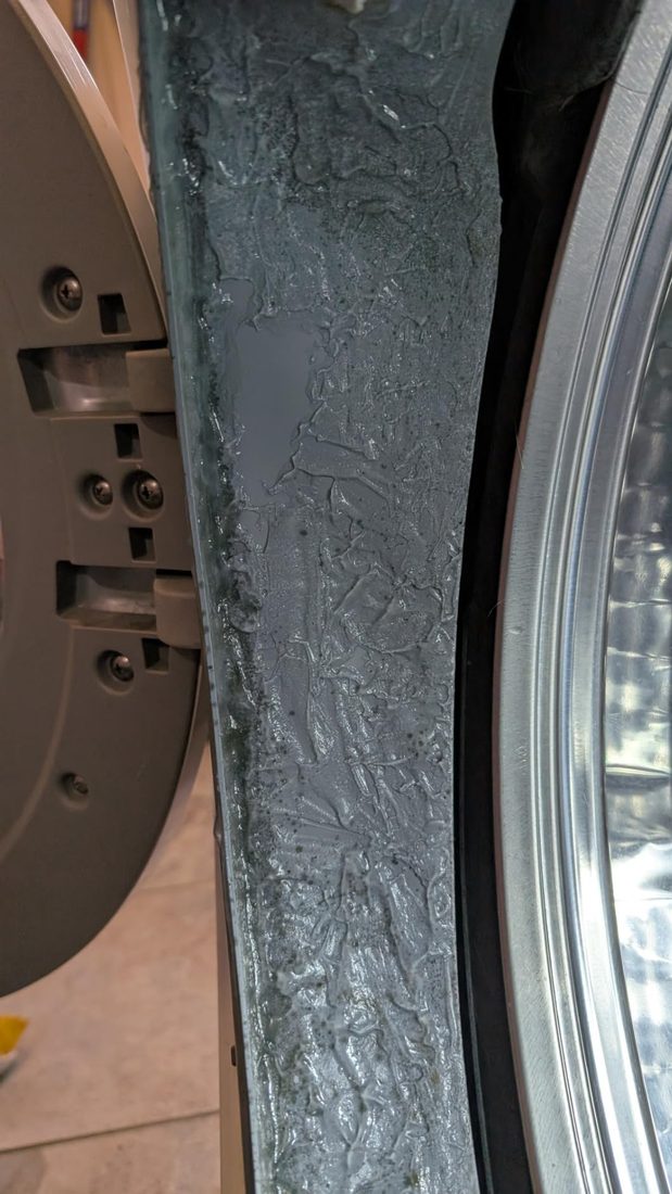 ACTIVE Mold Stain Gel freshly applied to the washer gasket — a thick wet coating along the rubber surface